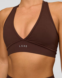 Woman wearing Stamina Sports Bra - Hot Chocolate | Set:true | Angle:closeup | Model:Amity | Size:S | Thumbnail Index: 3