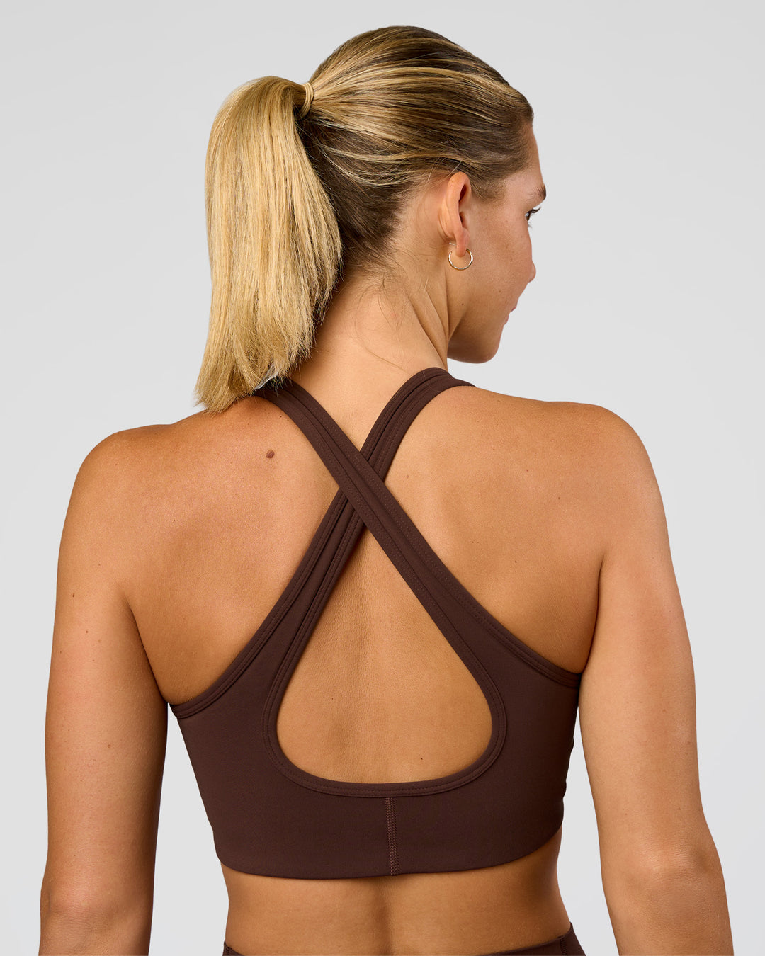 Woman wearing Stamina Sports Bra - Hot Chocolate | Set:true | Angle:back | Model:Amity | Size:S - view 2