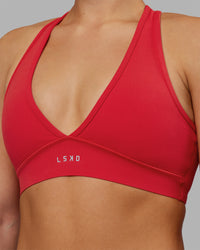 Woman wearing Stamina Sports Bra - Scarlet | Set:true | Angle:closeup | Model:Keisha | Size:S | Thumbnail Index: 7