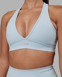 Woman wearing Stamina Sports Bra - Skyride | Set:true | Angle:closeup | Model:Rhiley | Size:S | Thumbnail Index: 7