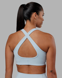 Woman wearing Stamina Sports Bra - Skyride | Set:true | Angle:back | Model:Rhiley | Size:S | Thumbnail Index: 3