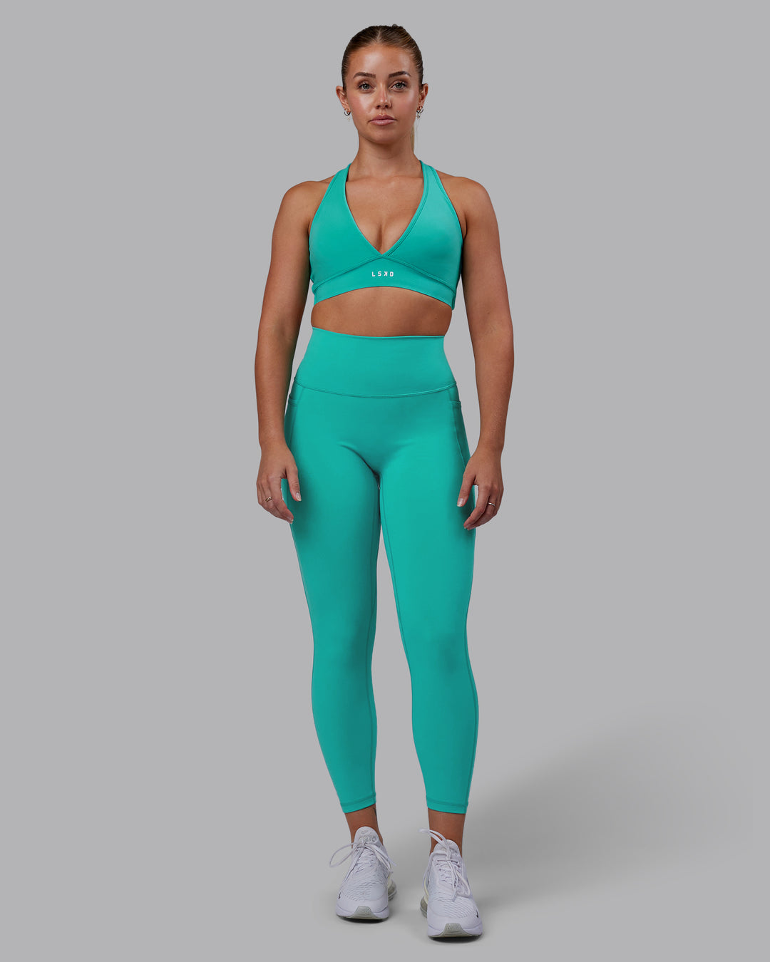 Woman wearing Stamina Sports Bra - Turquoise Tide - view 3