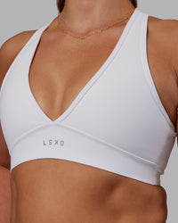 Woman wearing Stamina Sports Bra - White | Set:true | Angle:closeup | Model:Phoebe | Size:S | Thumbnail Index: 3