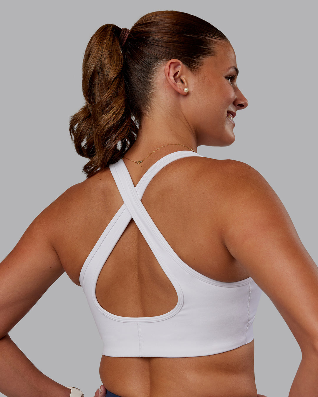 Woman wearing Stamina Sports Bra - White | Set:true | Angle:back | Model:Phoebe | Size:S - view 2