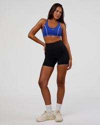 Woman wearing Stellar Sports Bra - Power Cobalt | Model:Kirstyn | Size:S | Thumbnail Index: 5