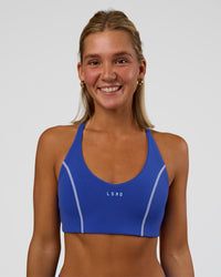Woman wearing Stellar Sports Bra - Power Cobalt | Model:Amity | Size:S | Thumbnail Index: 0