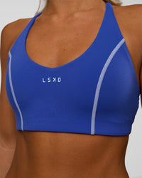 Woman wearing Stellar Sports Bra - Power Cobalt | Model:Amity | Size:S | Thumbnail Index: 3