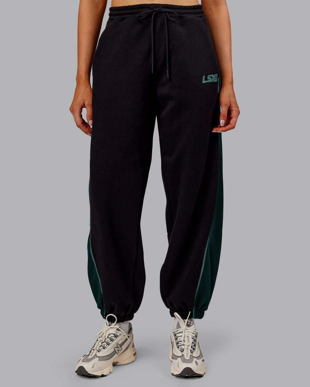 Woman wearing Stitch Up Fleece Sweat Pant - Black/Dark Moss | Model:Ella | Size:S - view 8