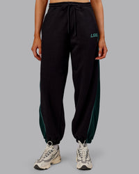 Woman wearing Stitch Up Fleece Sweat Pant - Black/Dark Moss | Model:Ella | Size:S | Thumbnail Index: 7