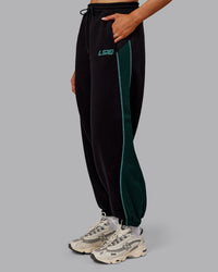 Woman wearing Stitch Up Fleece Sweat Pant - Black/Dark Moss | Model:Ella | Size:S | Thumbnail Index: 4