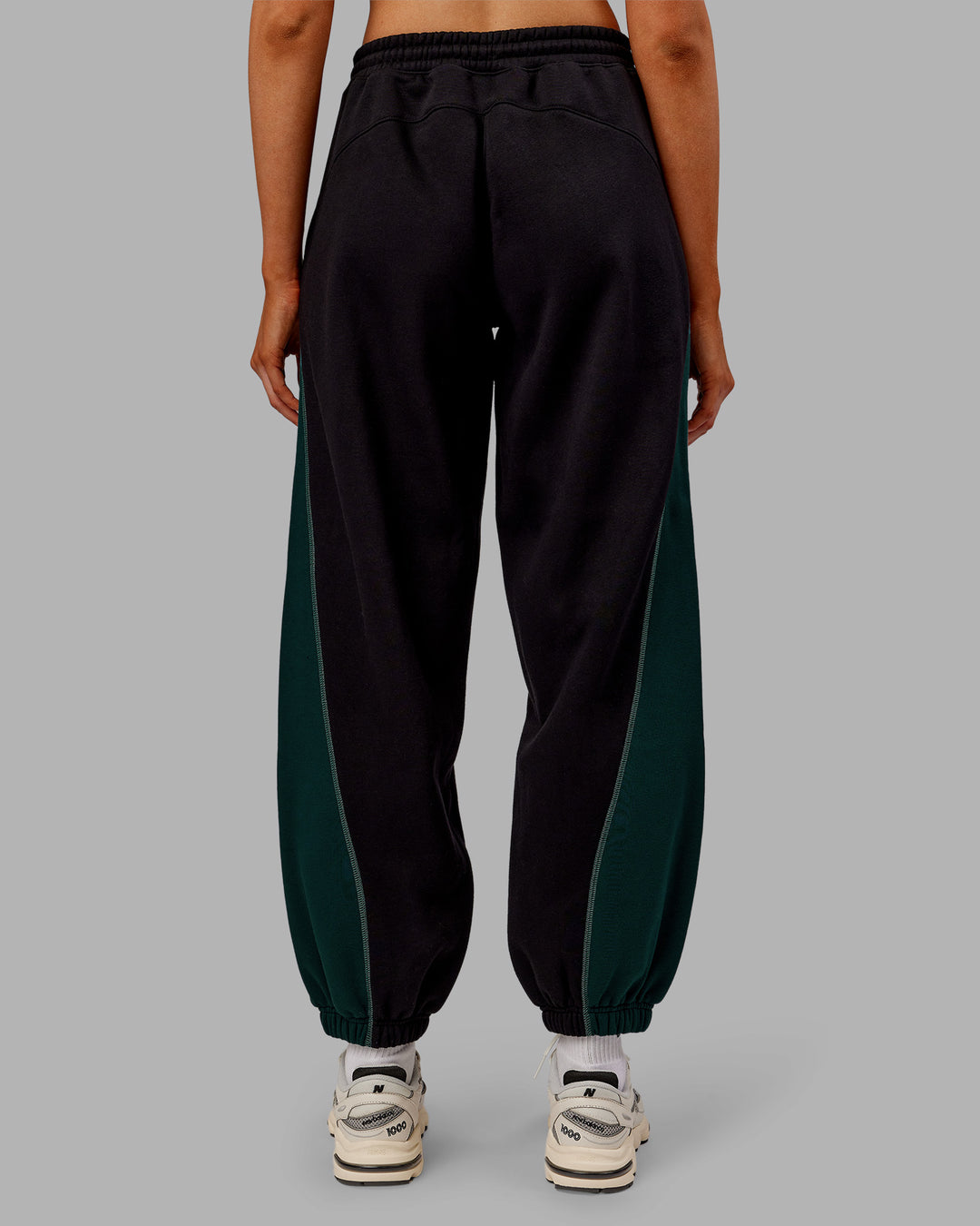 Woman wearing Stitch Up Fleece Sweat Pant - Black/Dark Moss | Model:Ella | Size:S - view 3