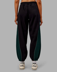 Woman wearing Stitch Up Fleece Sweat Pant - Black/Dark Moss | Model:Ella | Size:S | Thumbnail Index: 2