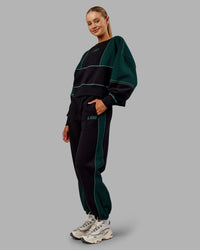 Woman wearing Stitch Up Fleece Sweat Pant - Black/Dark Moss | Model:Ella | Size:S | Thumbnail Index: 5