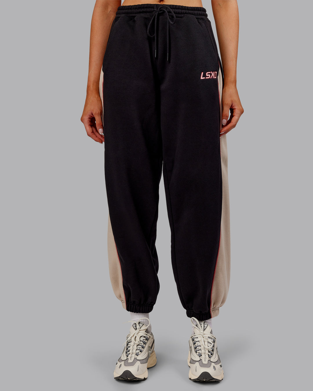 Woman wearing Stitch Up Fleece Sweat Pant - Black/Shale Beige | Model:Ella | Size:S - view 1