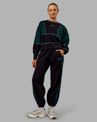 Woman wearing Stitch Up Oversized Fleece Sweater - Black-Dark Moss | Model:Ella | Size:S | Thumbnail Index: 5