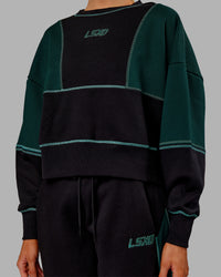 Woman wearing Stitch Up Oversized Fleece Sweater - Black-Dark Moss | Model:Ella | Size:S | Thumbnail Index: 6