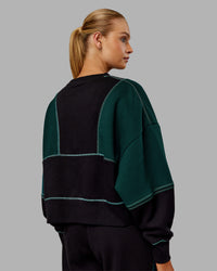 Woman wearing Stitch Up Oversized Fleece Sweater - Black-Dark Moss | Model:Ella | Size:S | Thumbnail Index: 3
