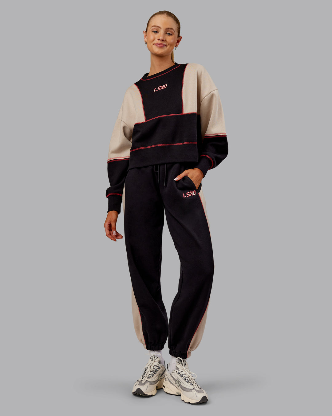 Woman wearing Stitch Up Oversized Fleece Sweater - Black-Shale Beige | Model:Ella | Size:S - view 2