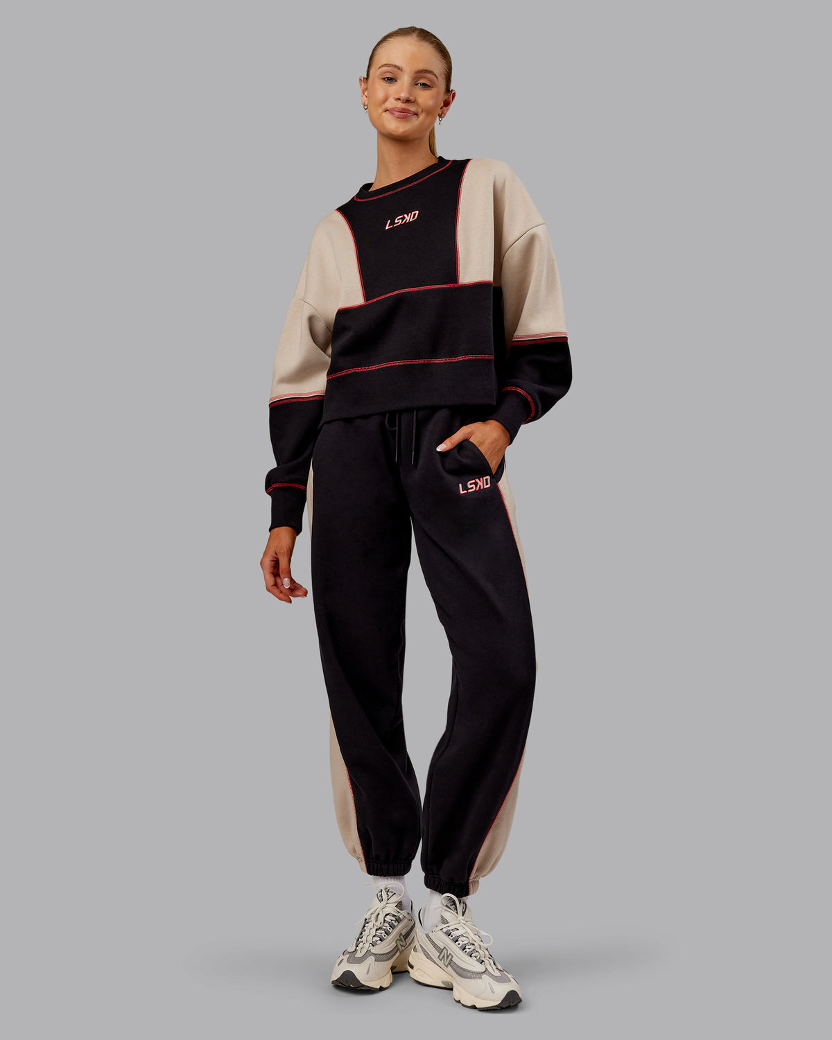Woman wearing Stitch Up Oversized Fleece Sweater - Black-Shale Beige | Model:Ella | Size:S