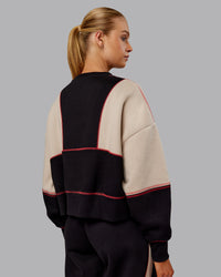 Woman wearing Stitch Up Oversized Fleece Sweater - Black-Shale Beige | Model:Ella | Size:S | Thumbnail Index: 2