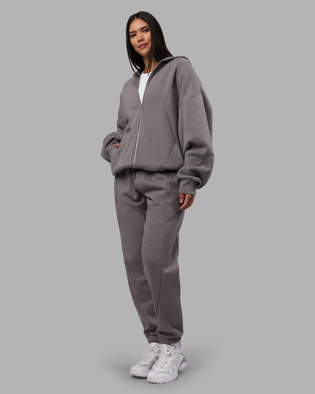 Woman wearing Stream Panel Track Pants - Storm Front | Model:Rhiley | Size:S - view 7