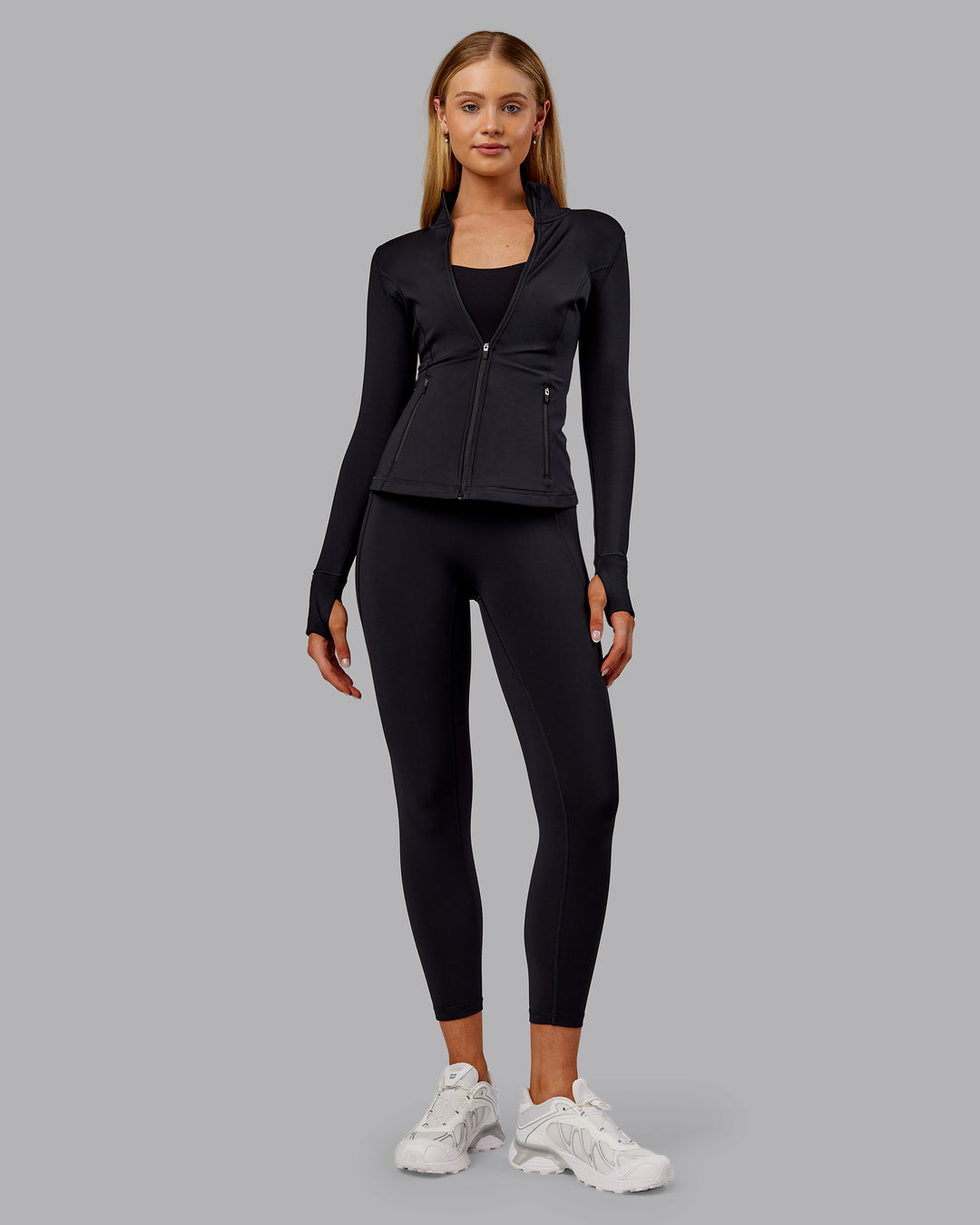 Woman wearing Stride Thermal Zip Through Jacket - Black | Model:Ella | Size:S - view 8