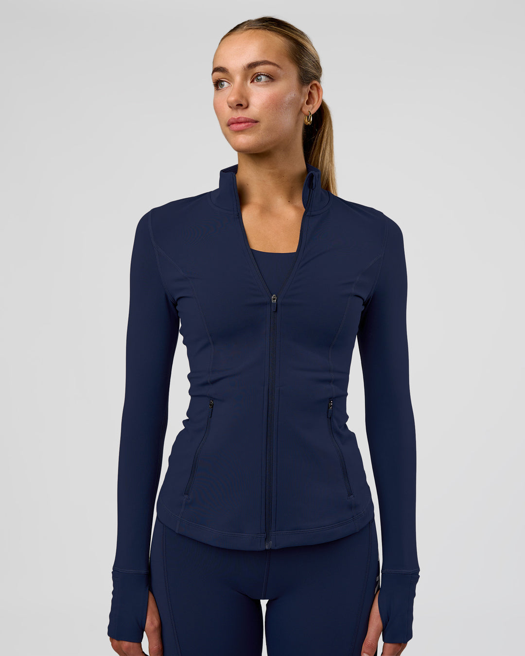 Woman wearing Stride Zip Through Jacket - Future Navy | Model:Evie | Size:S - view 2