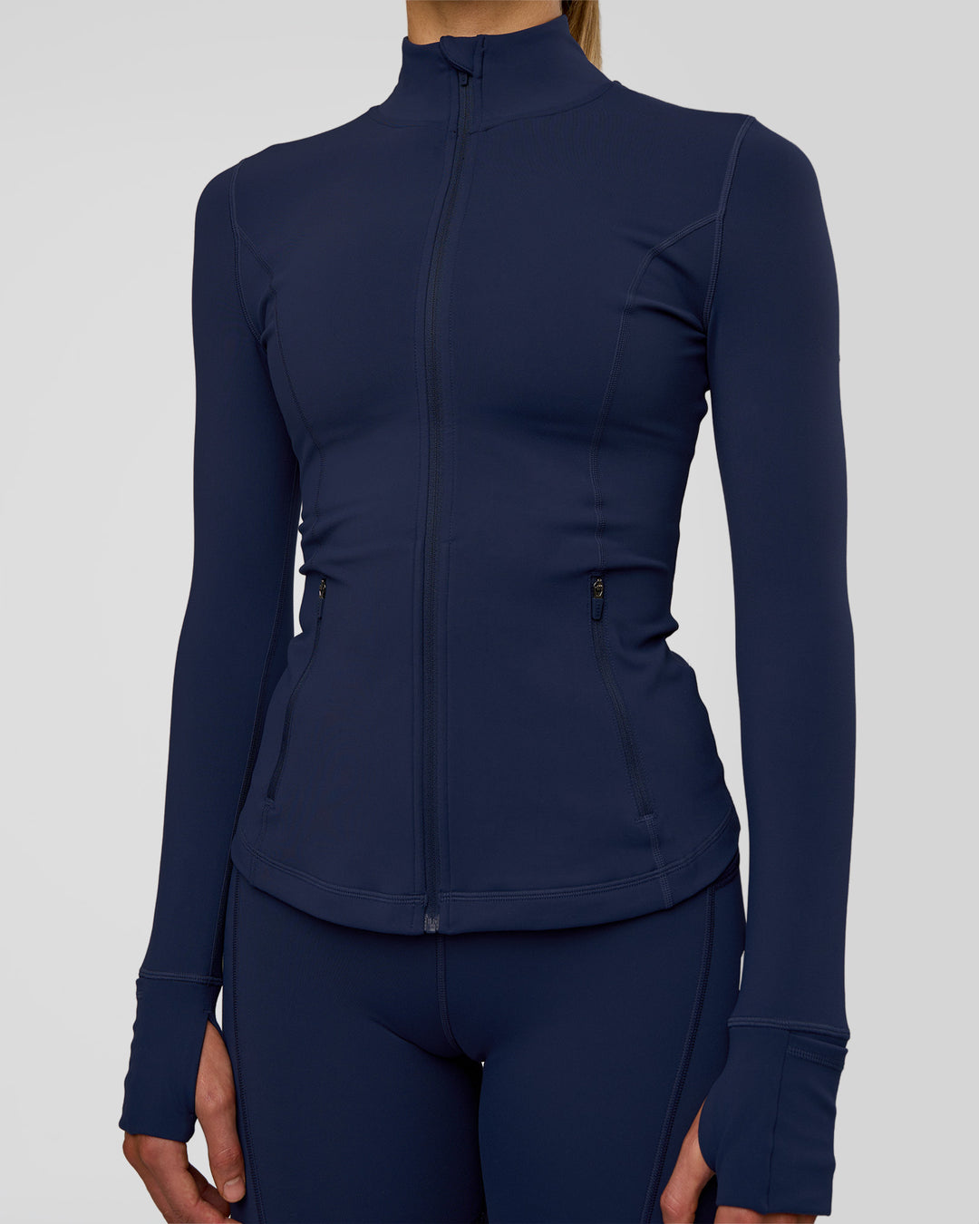 Woman wearing Stride Zip Through Jacket - Future Navy | Model:Evie | Size:S - view 7
