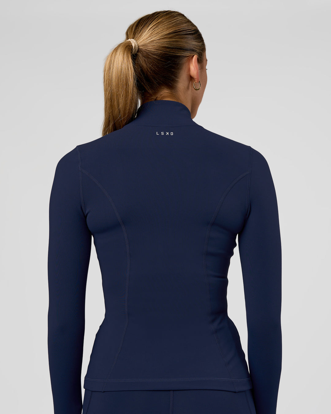 Woman wearing Stride Zip Through Jacket - Future Navy | Model:Evie | Size:S - view 3