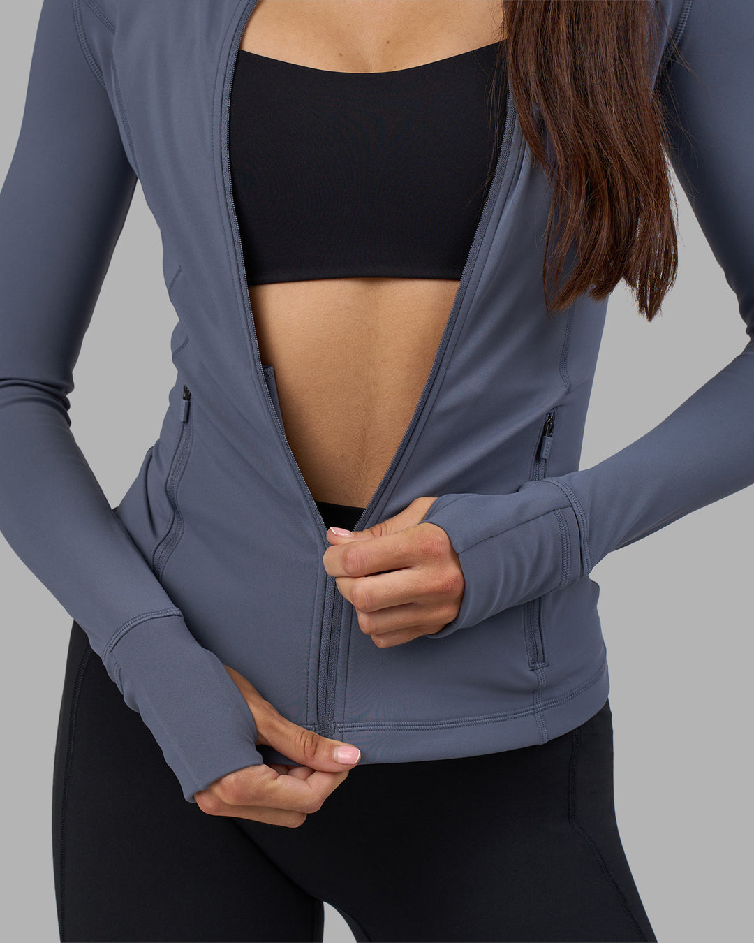 Woman wearing Stride Zip Through Jacket - Night Shadow | Model:Phoebe | Size:S - view 3