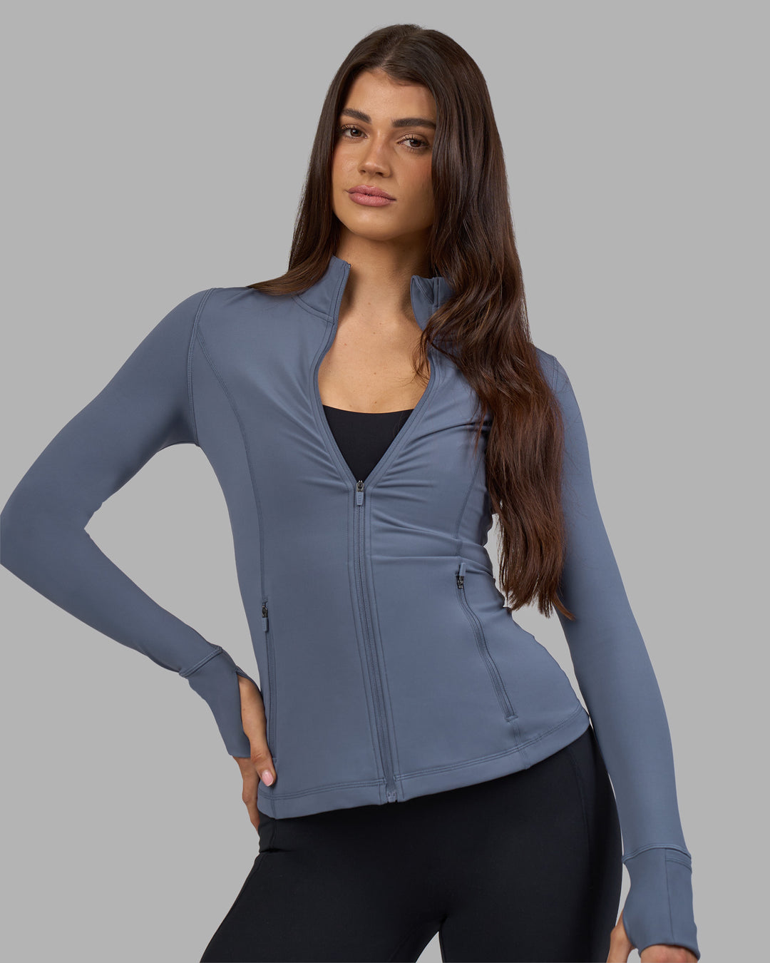 Woman wearing Stride Zip Through Jacket - Night Shadow | Model:Phoebe | Size:S - view 1