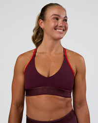 Woman wearing Strive Jacquard Sports Bra - Cherry Lacquer | Model:Sav | Size:S | Thumbnail Index: 2