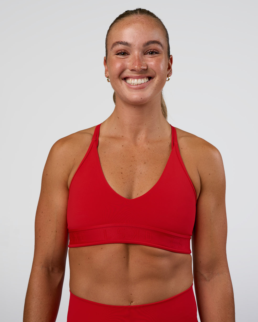 Woman wearing Strive Jacquard Sports Bra - Flame | Model:Sav | Size:S - view 2