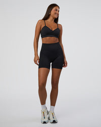Woman wearing Surge Seamless High-Rise 6" Short - Black | Model:Bianca | Size:S | Thumbnail Index: 3