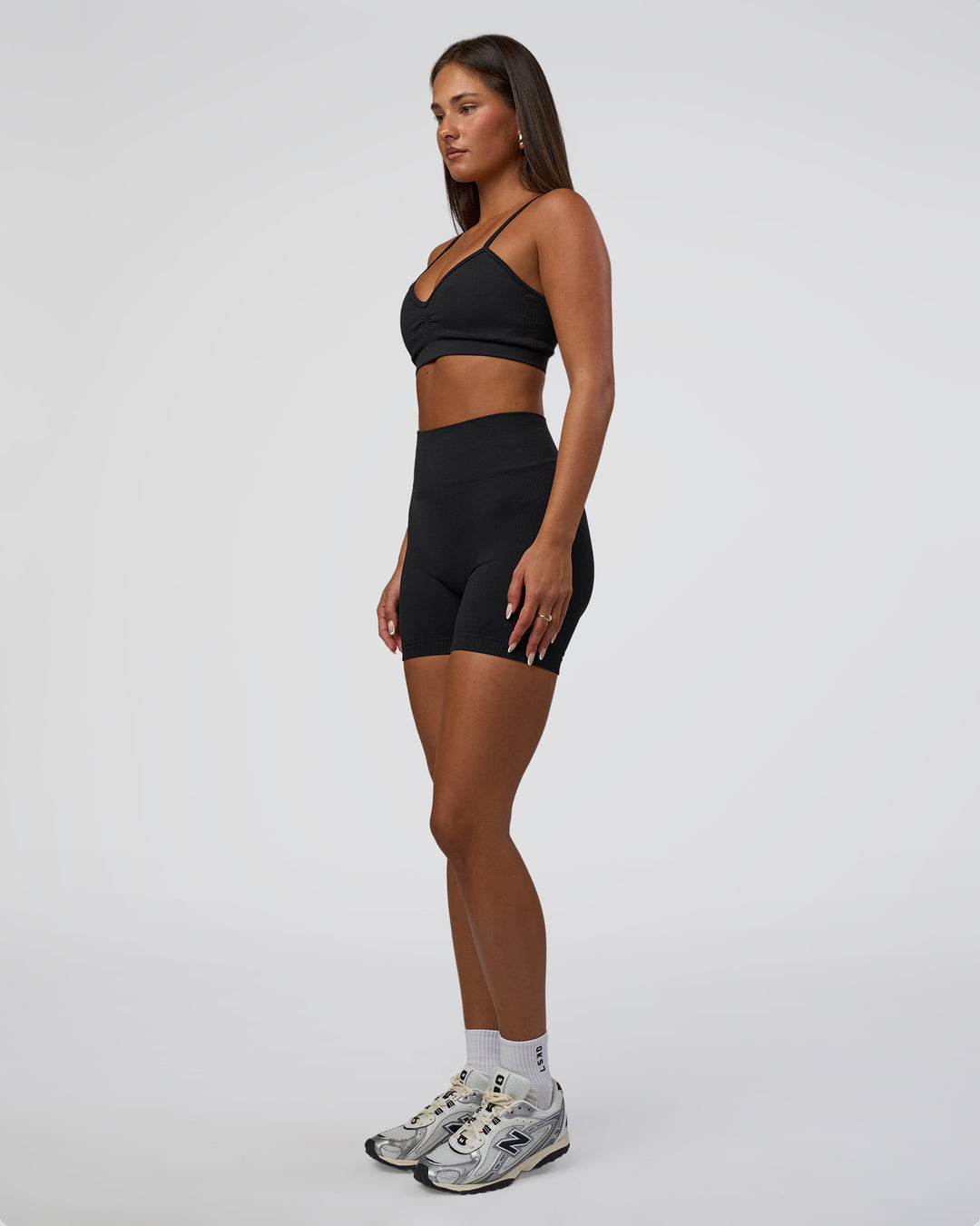 Woman wearing Surge Seamless High-Rise 6" Short - Black | Model:Bianca | Size:S - view 6