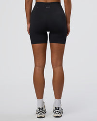 Woman wearing Surge Seamless High-Rise 6" Short - Black | Model:Bianca | Size:S | Thumbnail Index: 7