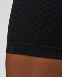 Woman wearing Surge Seamless High-Rise 6" Short - Black | Model:Bianca | Size:S | Thumbnail Index: 2