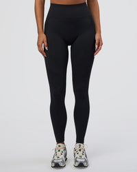 Woman wearing Surge Seamless High-Rise Full Length Legging - Black | Model:Bianca | Size:S | Thumbnail Index: 1