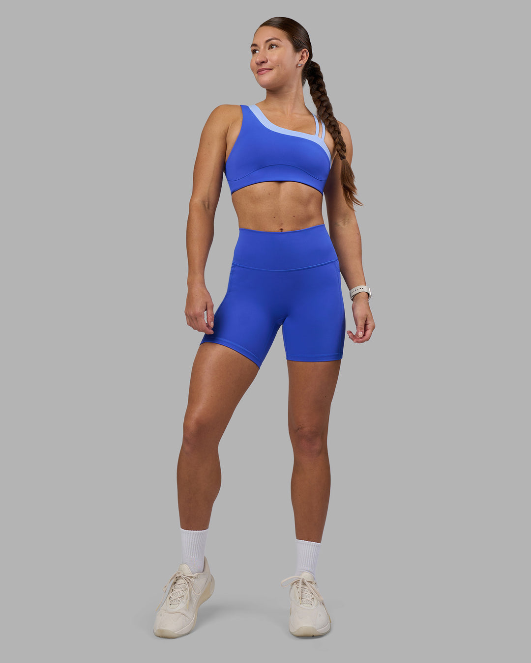 Woman wearing Thrive Asymmetric Sports Bra - Power Cobalt-Open Air | Model:Hannah | Size:S - view 6