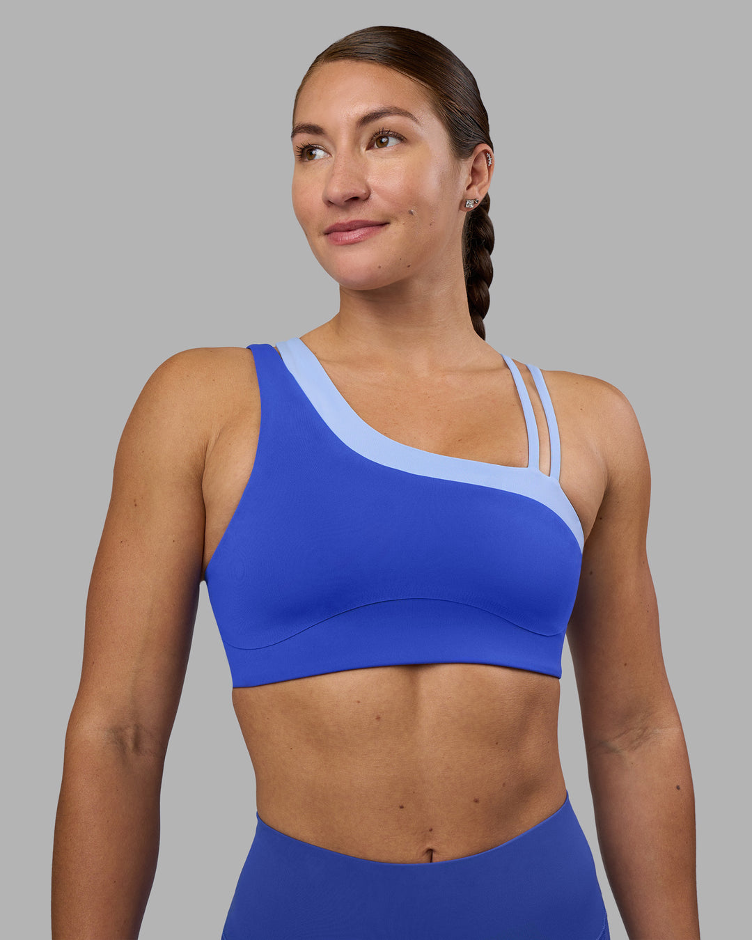 Woman wearing Thrive Asymmetric Sports Bra - Power Cobalt-Open Air | Model:Hannah | Size:S - view 2