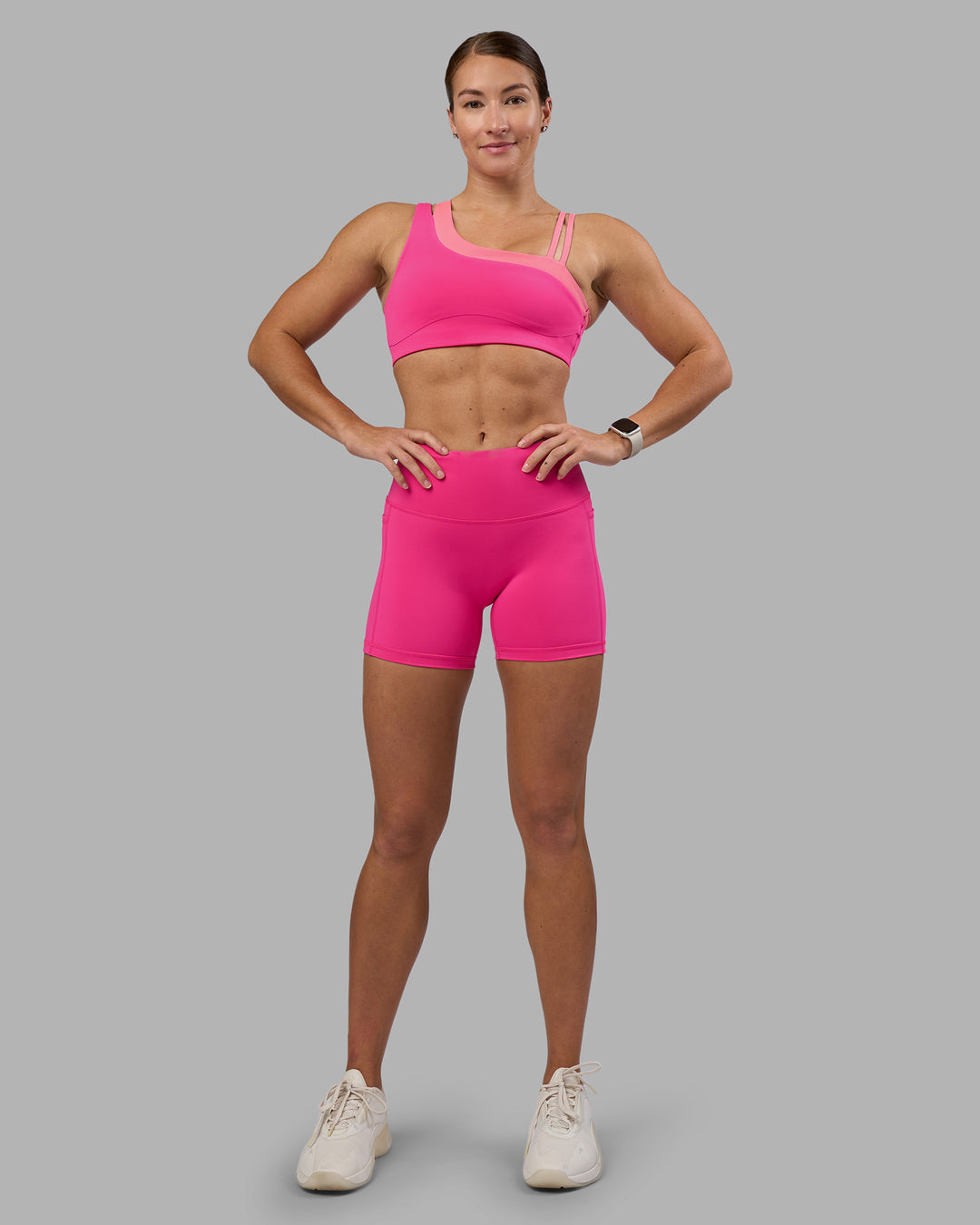 Woman wearing Thrive Asymmetric Sports Bra - Ultra Pink-Candy Pink | Model:Hannah | Size:S - view 6
