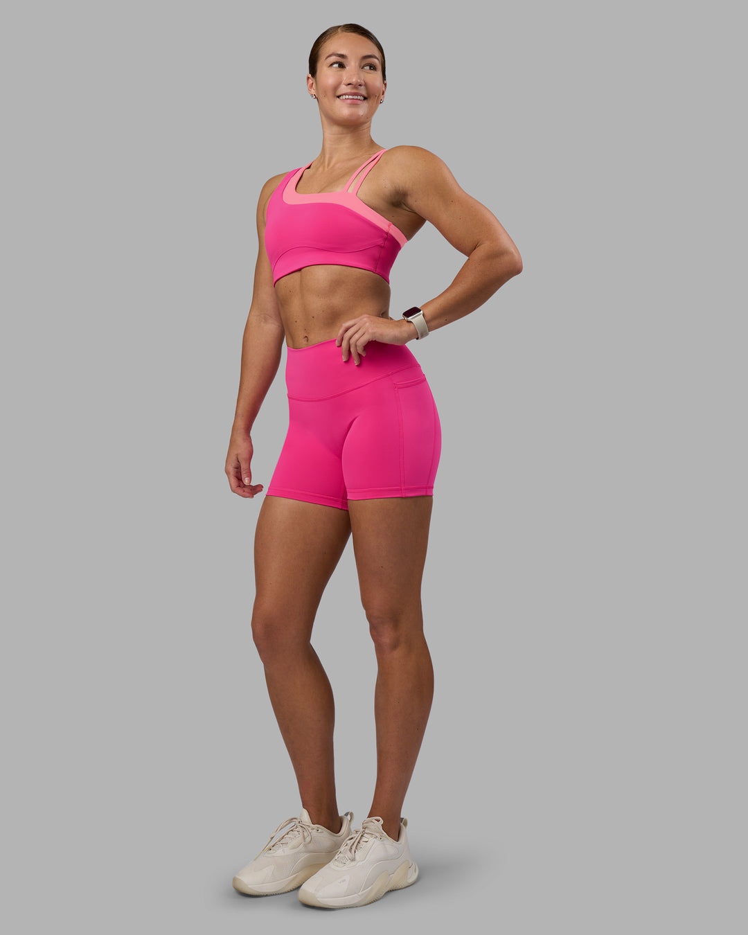 Woman wearing Thrive Asymmetric Sports Bra - Ultra Pink-Candy Pink | Model:Hannah | Size:S - view 4