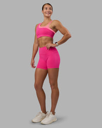 Woman wearing Thrive Asymmetric Sports Bra - Ultra Pink-Candy Pink | Model:Hannah | Size:S | Thumbnail Index: 3