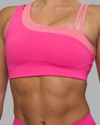 Woman wearing Thrive Asymmetric Sports Bra - Ultra Pink-Candy Pink | Model:Hannah | Size:S | Thumbnail Index: 7