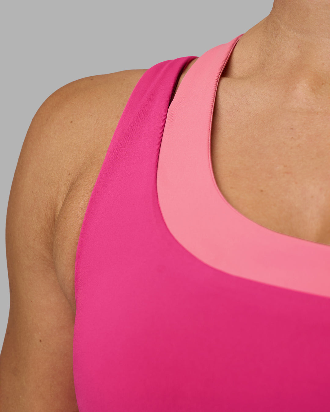 Woman wearing Thrive Asymmetric Sports Bra - Ultra Pink-Candy Pink | Model:Hannah | Size:S - view 5