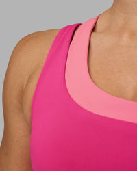 Woman wearing Thrive Asymmetric Sports Bra - Ultra Pink-Candy Pink | Model:Hannah | Size:S | Thumbnail Index: 4