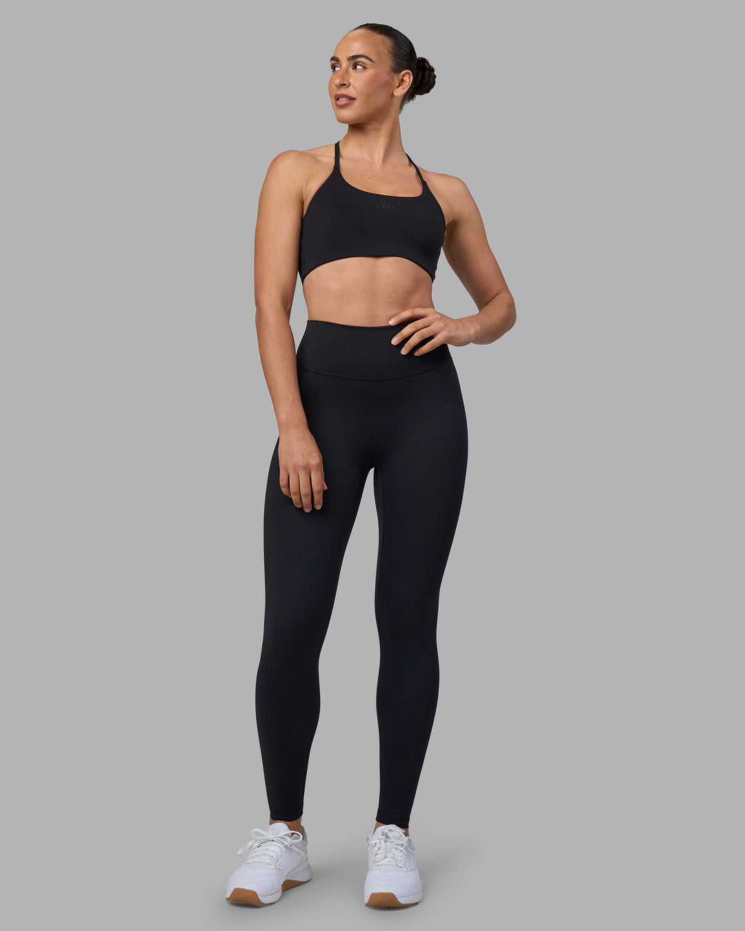 Woman wearing Twist Sports Bra - Black | Model:Sophie | Size:S - view 5