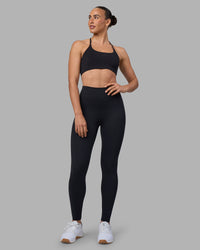 Woman wearing Twist Sports Bra - Black | Model:Sophie | Size:S | Thumbnail Index: 4
