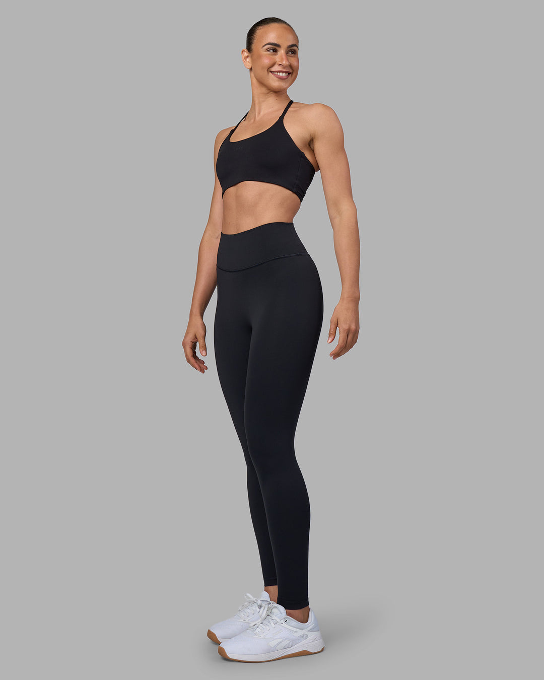 Woman wearing Twist Sports Bra - Black | Model:Sophie | Size:S - view 3