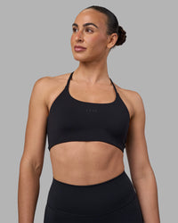 Woman wearing Twist Sports Bra - Black | Model:Sophie | Size:S | Thumbnail Index: 0